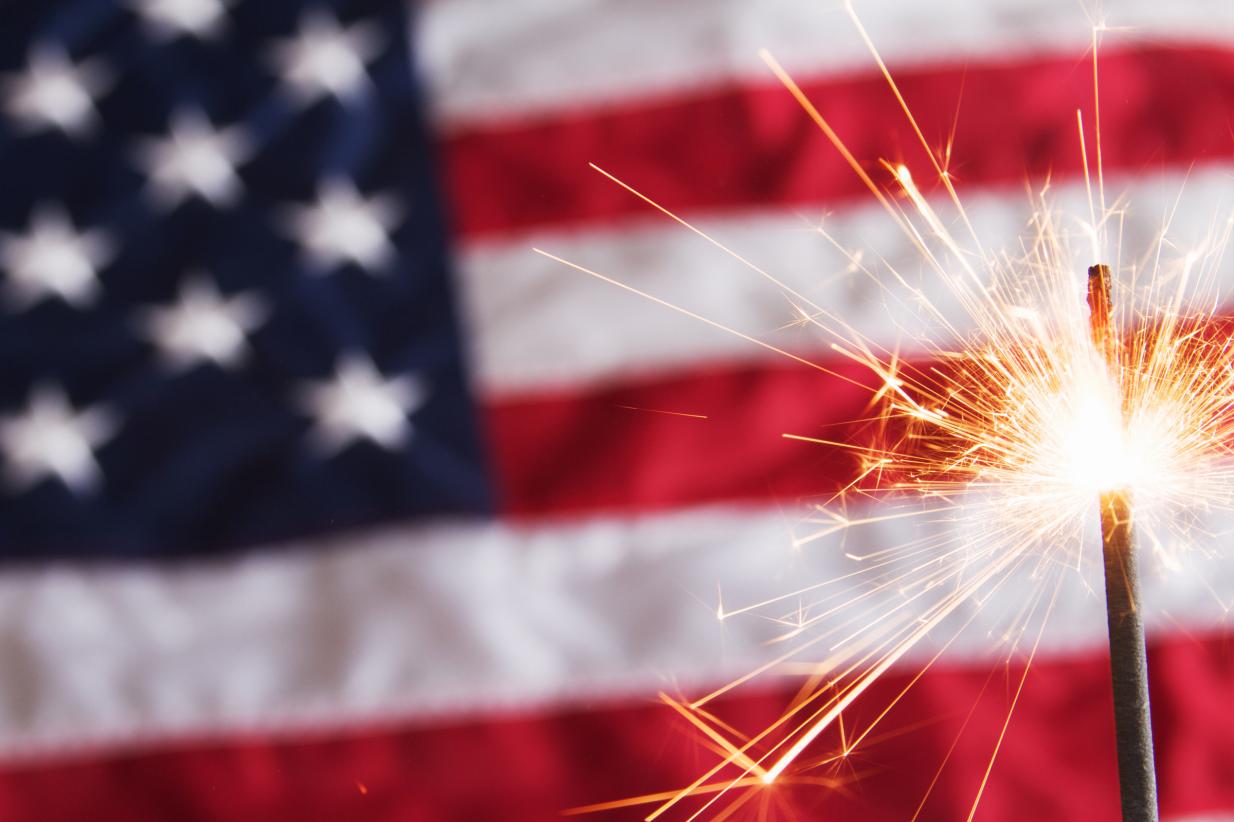 Sparkler in front of American Flag