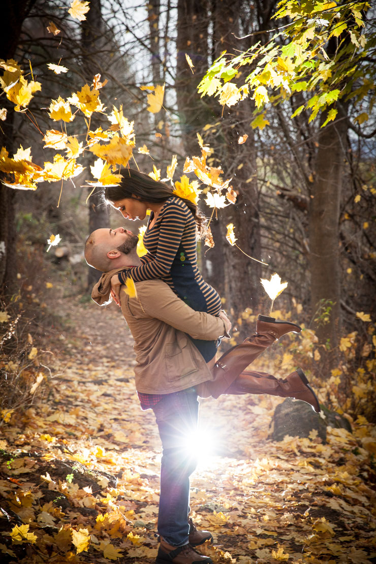 Gorgeous sun coming through fall engagement photo