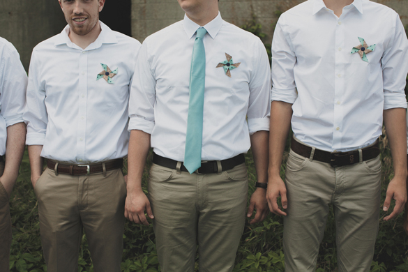 blue groomsmen tie and pinwheel boutonnieres