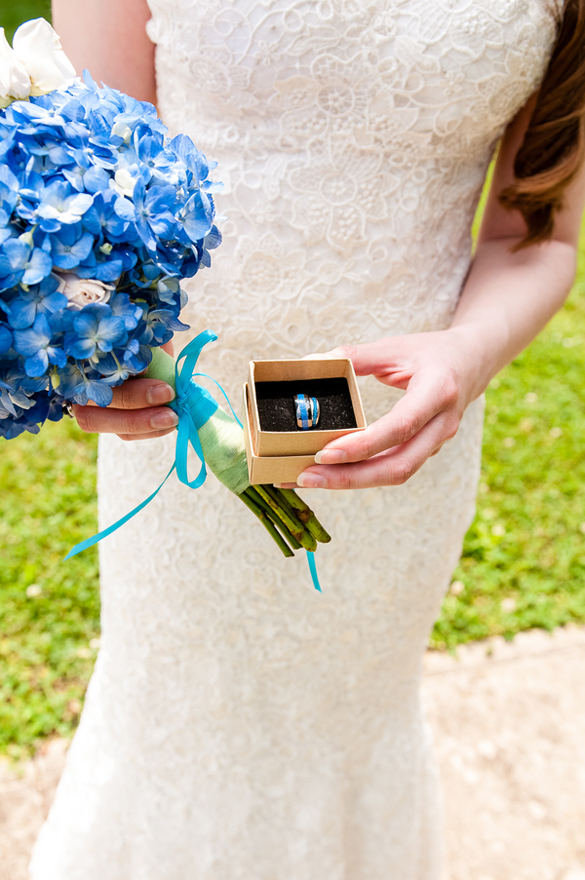 blue hydrangea bouquet and blue wedding rings