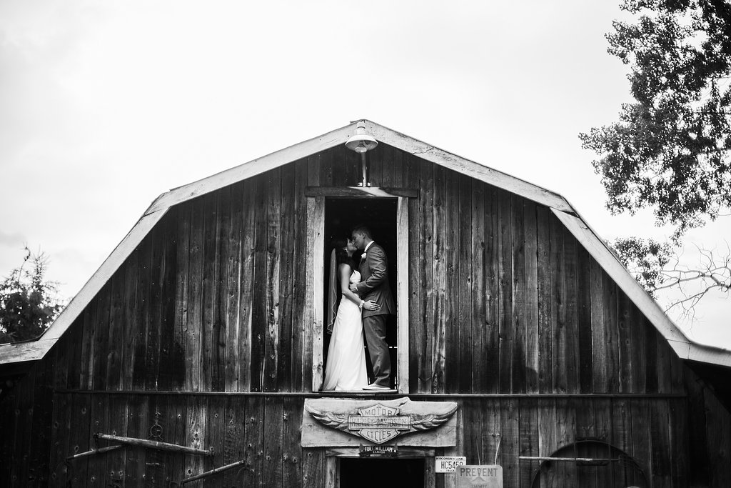 wedding photo of couple in barn