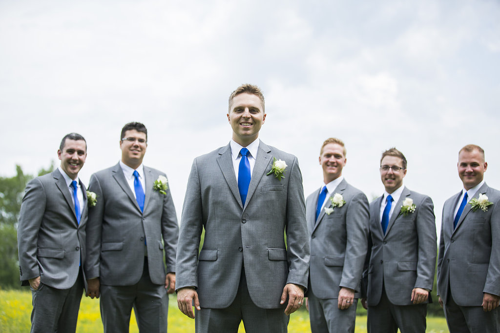 Groomsmen in gray suits and sapphire blue ties