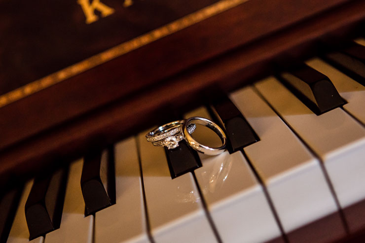Photo of wedding rings on piano