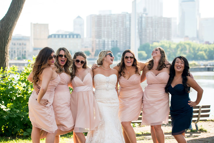 Bridesmaids in pink short dresses in Minneapolis outdoor wedding-photo by Bryan Jonathan Weddings