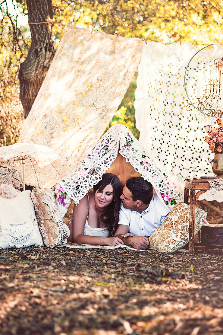 Bohemian rustic vintage engagement photo with couple in a fort 