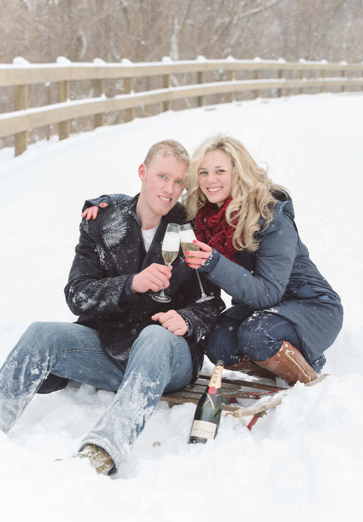 Drinking champagne in Chicago winter engagement session by Amy Aiello Photography