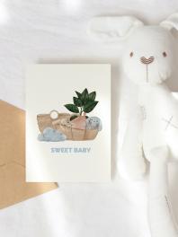 Writing a Greeting inside a Baby Shower Card