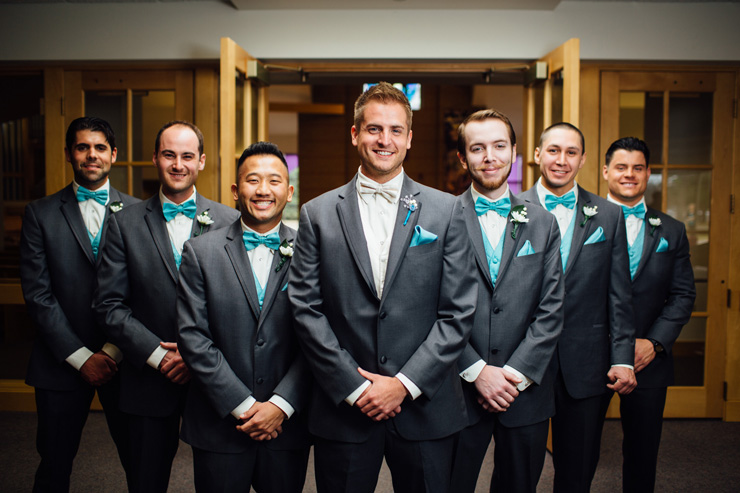 groomsmen in tiffany blue ties and vests