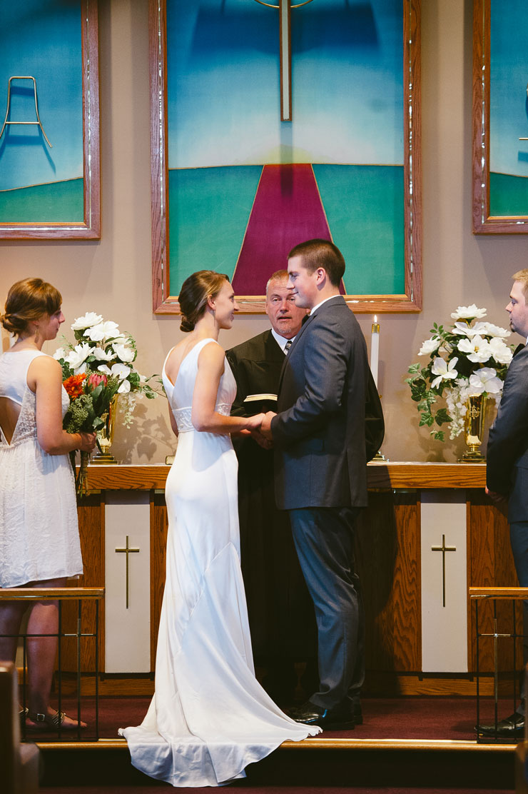 Elegant neutral wedding: Bride and Groom at the altar