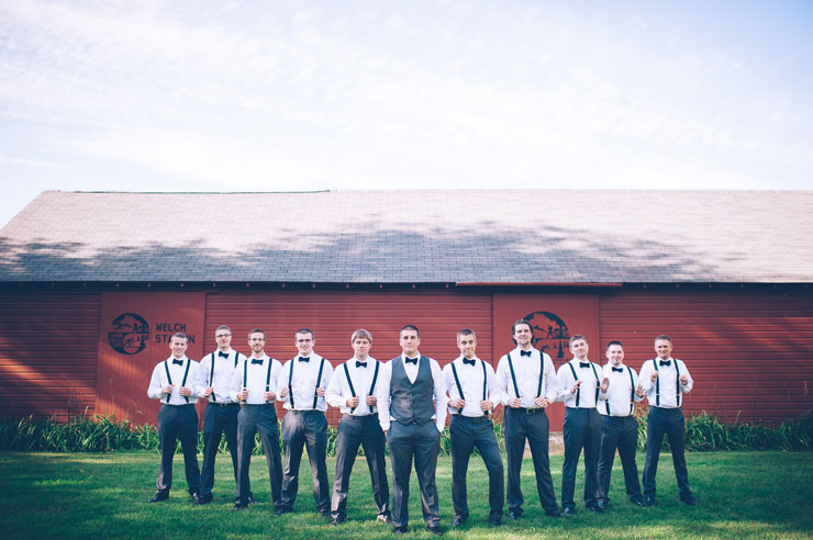Groomsmen in gray suits, bow ties and suspenders 