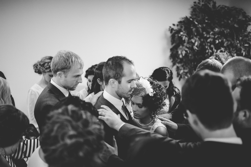 Bride and Groom being prayed over during wedding ceremony