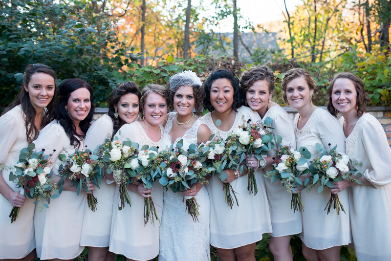 Bridesmaids in short ivory dresses