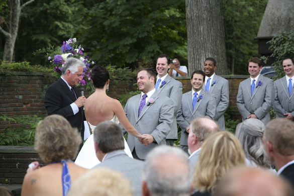 Groomsmen in outdoor wedding ceremony