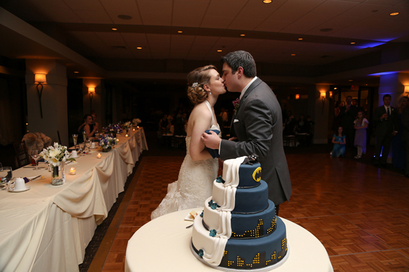 bride and groom and batman wedding cake