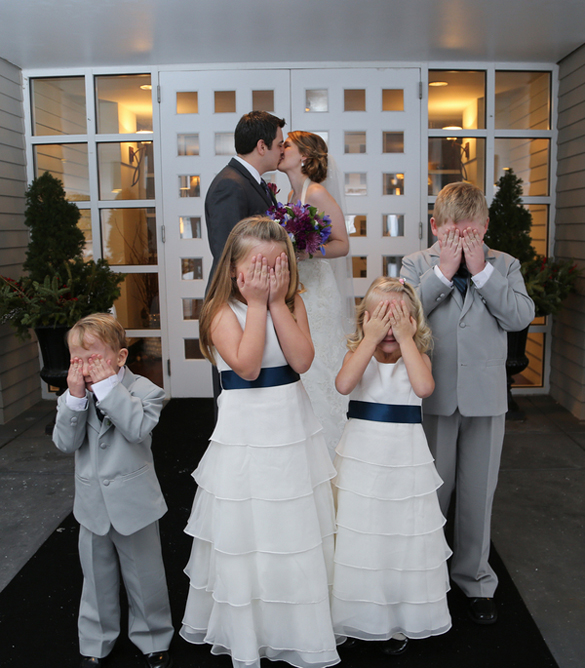 bride and groom with flower girls and ring bearers