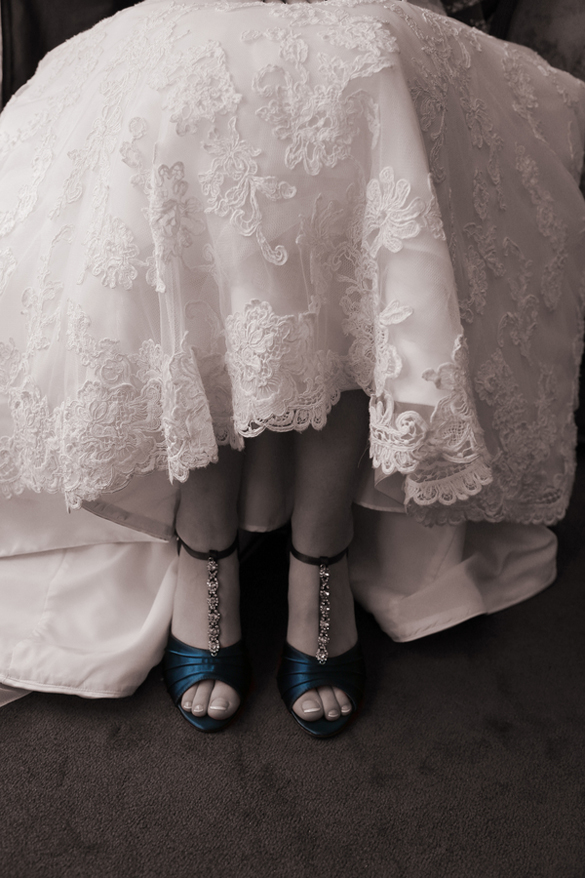 lace wedding dress and blue wedding shoes
