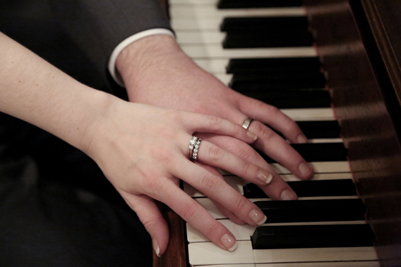 unique wedding ring shot on piano