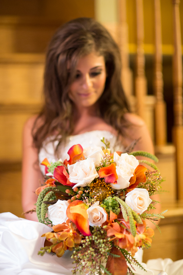 Rustic fall wedding bouquet of calla lilies, roses and berries
