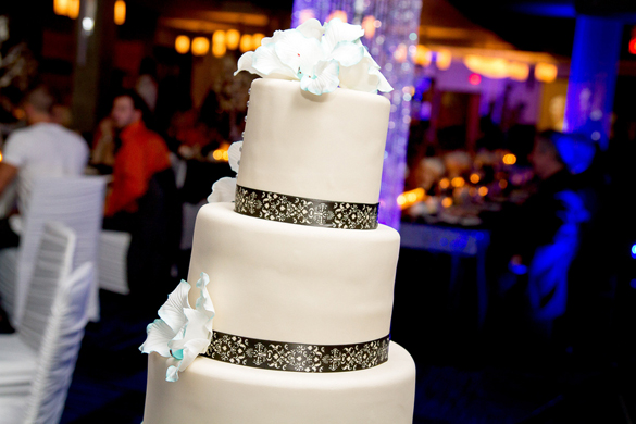 white wedding cake with brown damask bands