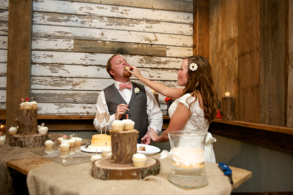 bride and groom eating wedding cake