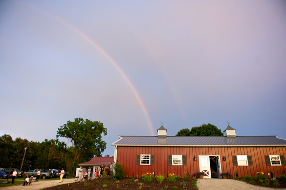 double rainbow over barn reception