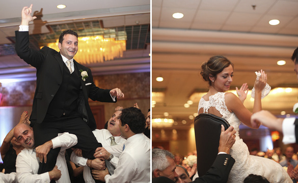 bride and groom being lifted up on chairs at the wedding reception