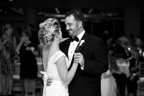black and white photo of bride and groom dancing at wedding reception
