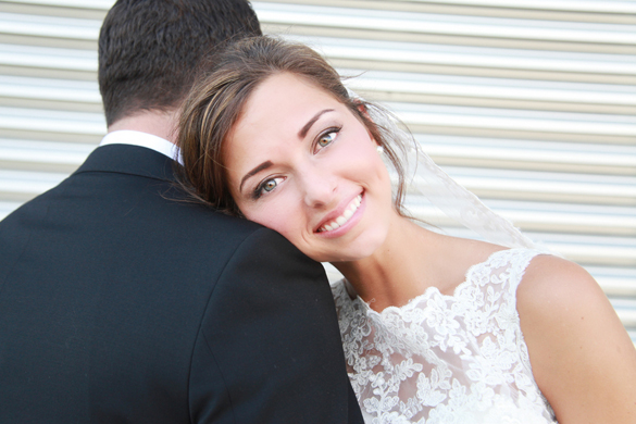sweet bride photo with her head resting on her husband's shoulder