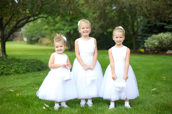 flower girls dressed in white and pink