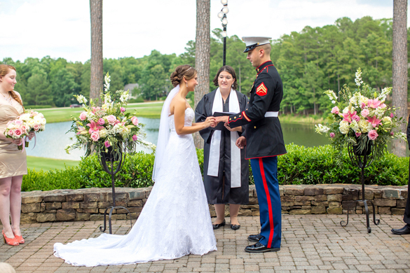 exchanging rings at military wedding ceremony