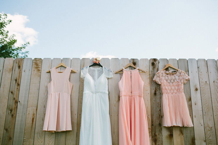 Coral bridesmaid dresses in budget backyard wedding