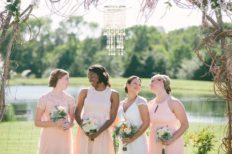Bridesmaids in coral dresses