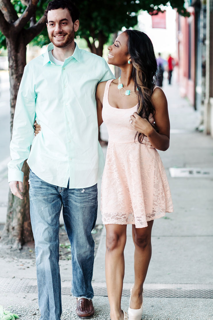 Engagment photo of couple walking in Atlanta, GA